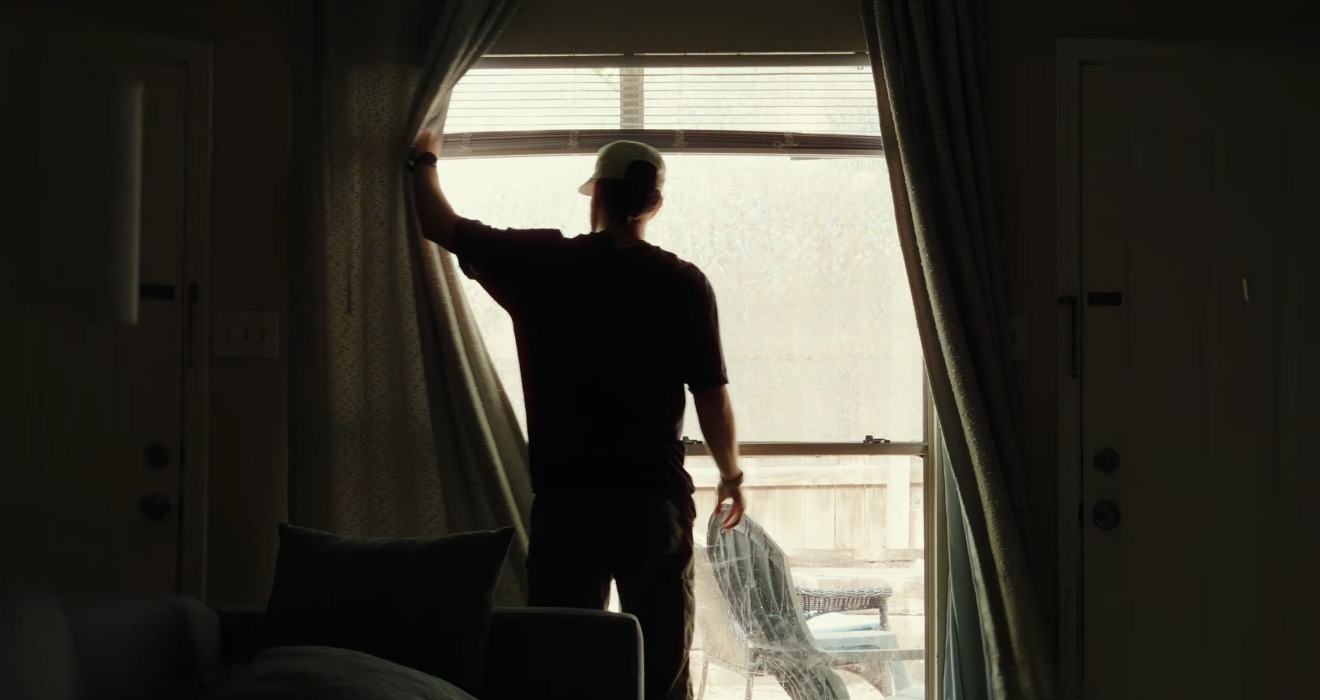 Tanner McCartney looking out window